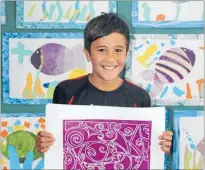  ?? Photos: TE PAPA ?? Valuable work: Levi Ware from Ngati Toa School with his artwork, Carving Treasures. He said carving was a way of expressing himself and that pou can protect people.