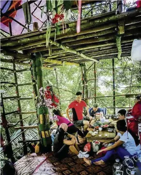  ??  ?? having snacks inside a cosy trekkers’ tree house at Apek hill.