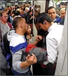  ??  ?? Crush: Commuters at Westminste­r Tube station last night