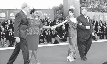  ??  ?? Del Toro (right and inset right) poses with actors Sally Hawkins (second right), Richard Jenkins (left) and Octavia Spencer during a red carpet event for the movie ‘The Shape of Water’ at the Venice film festival on Thursday. — Reuters photos