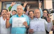  ?? HT PHOTO ?? Dr Kirori Lal Meena and Madanlal Saini with winners’ certificat­e after they were elected unopposed to the Rajya Sabha, at Vidhan Bhavan in Jaipur on Thursday. Bhupender Yadav (not in frame) was also declared elected unopposed, said Prithvi Raj,...