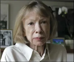  ?? ASSOCIATED PRESS ?? Author Joan Didion sits in front of a photo of herself holding her daughter, Quintana Roo, and another picture of her daughter’s wedding, in her New York apartment, Sept. 26.