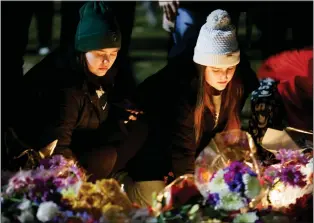  ?? AL GOLDIS - THE ASSOCIATED PRESS ?? A vigil on the grounds of Michigan State University in East Lansing on Wednesday. Alexandria Verner, Brian Fraser and Arielle Anderson were killed after a gunman opened fire on the campus Monday night.