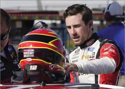  ?? STEVE HELBER — THE ASSOCIATED PRESS ?? Driver Ryan Blaney, looking for a spot in the playoffs, prepares Saturday for qualifying at Richmond Raceway for today’s NASCAR Cup Series race.