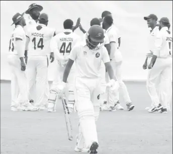  ??  ?? Vishual Singh walks back after being dismissed for 90 (Romario Samaroo photo)