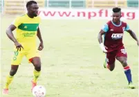  ??  ?? Abraham Audu (left) of El-Kanemi and Bright Onyedikach­i of FC IfeanyiUba­h vie for the ball during a league match