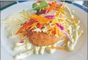  ??  ?? FLAGSHIP PISMO’S appetizer selections include panko-crusted crabcakes with green-chile aioli.