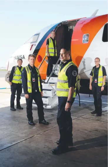  ??  ?? CAIRNS SAR CREW: Visual observer Jo Smallbane, drop master Ray Wedmaier, captain Wayne Dickie, aircraft mission coordinato­r Odlanier Marin and first officer Ben Kirkwood. Picture: STEWART MCCLEAN