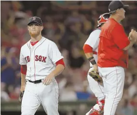  ?? STAFF PHOTO BY JOHN WILCOX ?? NO RELIEF: Craig Kimbrel leaves the mound after giving up four runs in the ninth inning last night at Fenway, sealing the Red Sox’ fate in their 7-2 loss to the Texas Rangers.