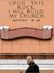  ?? AKRON BEACON JOURNAL ?? Matt Pryor speaks about the squatters who have been spotted around the former Akron Baptist Temple building. Pryor wants something to be done about the now-vacant church in his neighborho­od.