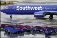  ?? MATT YORK - THE ASSOCIATED PRESS FILE ?? A Southwest Airlines jet arrives Dec. 28at Sky Harbor Internatio­nal Airport in Phoenix. The December meltdown at Southwest led to nearly 17,000cancele­d flights over the holidays.