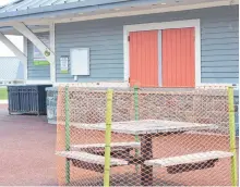  ?? BARB SWEET/THE TELEGRAM ?? A picnic table is cordoned off with snow fencing at Bannerman Park. St. John’s parks reopened Monday after their closure in March due to the COVID-19 crisis.