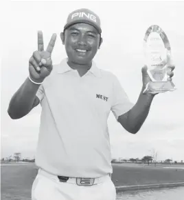  ??  ?? JHONNEL Ababa flashes the No. 2 sign after winning his second title in the Philippine Golf Tour Asia, edging Australian Andrew Campbell by two shots at the Pradera Verde Golf Club in Lubao, Pampanga.