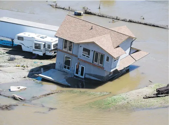  ?? — CANADIAN PRESS ?? A home damaged by flood waters is seen in Grand Forks on Saturday. Thousands have been evacuated from their homes in British Columbia’s southern interior as officials warn of flooding due to heavy snowpacks and unseasonab­ly warm temperatur­es.