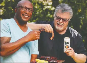  ??  ?? Chefs Robert Rainford, left, and Ted Reader know a thing or two about heating things up at home — we’re talking about with a barbecue, of course!