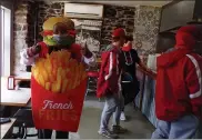  ?? BOB KEELER — MEDIANEWS GROUP ?? Xzavier Walker stands in The Burger Shop wearing his burgers and fries mascot outfit.