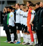  ??  ?? STANDING AS ONE: the Derby squad take their stance before yesterday’s game