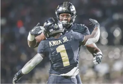  ?? GETTY IMAGES ?? D.J. Knox and Darius Pittman celebrate a touchdown during the first half of Purdue’s rout Saturday of Ohio State.