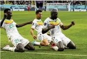  ?? FRANCISCO SECO / AP ?? Senegal’s Kalidou Koulibaly (right) celebrates with teammates after scoring his side’s second goal in a 2-1 victory against Ecuador on Tuesday.