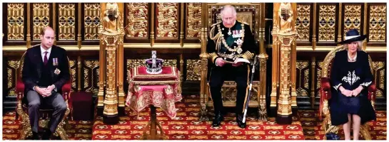  ?? ?? Notable absence: The Prince of Wales, centre, stands in for the Queen flanked by Prince William and the Duchess of Cornwall