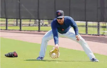  ?? Photos by Karen Warren/Staff photograph­er ?? Astros outfielder Michael Brantley takes ground ball practice Tuesday during the first full-squad workout at the Astros’ spring training complex in West Palm Beach, Fla.