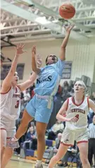  ?? ?? Kearney's Klarissa Goode drives in to score in the second quarter between Penfield's Lena Lipani and Ashley Kalvitis.