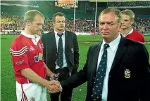 ??  ?? Graham Henry, right, can’t even look as he shakes hands with Matt Dawson, while Austin Healey looks on, at the end of the 2003 Lions tour.
