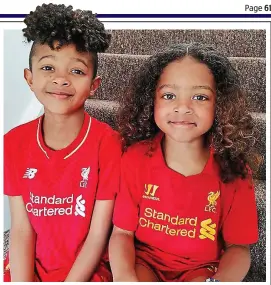  ??  ?? Passionate: Elijah, seven, and Isaac, five, support Liverpool