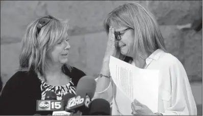  ?? AP/The Arizona Republic/ROB SCHUMACHER ?? Terri Crippes (left) and Lori Lyon, Kayla Mueller’s aunts, discuss their niece’s death Tuesday at a news conference in Prescott, Ariz.