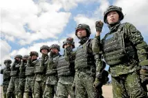  ?? AP ?? The first team of Taiwan artilleryw­omen poses for the press during the annual Han Kuang exercises in Pingtung County, Southern Taiwan.