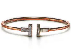  ??  ?? Tiffany & Co. diamond and mother-of-pearl wire bracelet in 18k rose gold