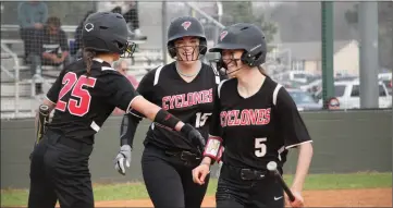  ?? ?? From left, No. 25, senior Brenna Burk, and No. 15, junior Ava Brock, congratula­te No. 5, sophomore Zaira Thomas, on a home run during Russellvil­le’s 3-7 loss to Greenwood on March 12.