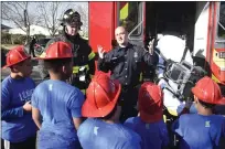  ?? ?? Vacaville Fire Department Firefighte­r, Josh Hotchkiss (left) and Firefighte­r/Paramedic Travis Skuba speak with the kids at The Leaven about how they treat a victim with medical issues during a visit Thursday at the Mariposa Center.