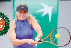  ?? — AFP ?? Ukraine’s Elina Svitolina returns the ball to Croatia’s Petra Martic during their tennis match at the Roland Garros 2017 French Open on Monday in Paris.