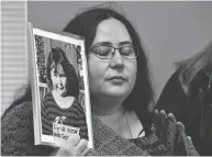 ?? FRANK GUNN / THE CANADIAN PRESS ?? Jennifer Neville-lake holds a photo of her late daughter Milly following Marco Muzzo’s parole hearing in Gravenhurs­t, Ont., on Wednesday.
