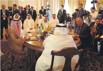  ?? AP ?? Sheikh Abdullah bin Zayed, Minister of Foreign Affairs and Internatio­nal Co-operation, with Adel Al Jubeir, left, Sameh Shoukry, right, and Khalid bin Ahmed Al Khalifa, foreign ministers from Saudi Arabia, Egypt and Bahrain, discuss the diplomatic situation with Qatar, in Cairo, in July last year