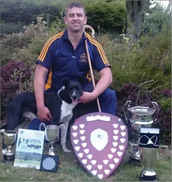  ??  ?? Paul O’Donnell, from Glenealy, with his faithful dog, Tim, with the cups and trophies they’ve won.