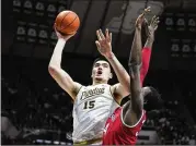  ?? MICHAEL CONROY/ASSOCIATED PRESS ?? Purdue center Zach Edey shoots over Ohio State center Felix Okpara during Sunday’s game in West Lafayette, Ind. Purdue won 82-55 as Edey posted his 21st double-double.