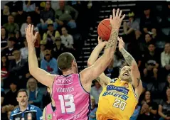  ?? GETTY IMAGES ?? Nathan Sobey, of the Bullets, is challenged by Tom Vodanovich, of the Breakers, in their Australian NBL clash yesterday.