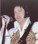 ?? George Hill 1977 ?? Elvis Presley in Jacksonvil­le, Fla., in 1977: No one alive seemed more dead.