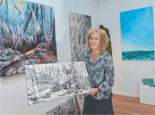  ??  ?? Fogg Dam has captured the interest of a group of Darwin-based artists, including painter Alison Worsnop Pictures: KATRINA BRIDGEFORD