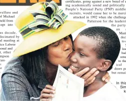  ??  ?? In this file photo, then Leader of the Opposition Portia Simpson Miller gives Jereese Brown a congratula­tory kiss for winning first place in the Seabed Preparatio­n category at the opening day of the 2009 Denbigh Agricultur­al Show.