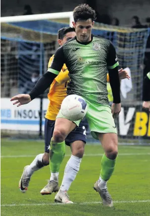  ?? Www.mphotograp­hic.co.uk ?? ●●Elliot Osborne shields the ball at Torquay