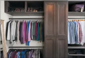  ?? STACY ZARIN GOLDBERG — CASE DESIGN VIA THE ASSOCIATED PRESS ?? A closet designed by Elena Eskandari, an interior designer specialist at Case Design. As you plan out a walk-in closet, consider the size of the items you’ll be hanging. This closet pictured has two levels of hanging space which offers room for a large...