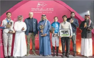  ?? ?? The connection of Inverness after being awarded their trophies and prizes by Ali Al Rumaihi, Secretary-General,Qatar Equestrian Federation, at the Al Rayyan Racecourse on Thursday.