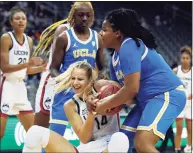  ?? Noah K. Murray / Associated Press ?? UConn forward Dorka Juhasz, left, and UCLA forward IImar’I Thomas battle for a rebound on Dec. 11. Juhasz will be available for Sunday’s game after sitting out two games with a foot injury.