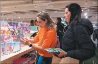  ?? PROVIDED TO CHINA DAILY ?? Consumers shop at Pop Mart’s first Paris store.