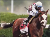  ?? Seth Wenig / Associated Press ?? Tiz the Law, with jockey Manny Franco up, approaches the finish line on his way to winning the 152nd running of the Belmont Stakes horse race in Elmont, N.Y., in June.