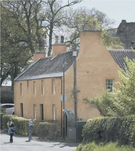  ??  ?? A postcard (right) marks Burns’ visit to the old Roslin Inn – now Collegehil­l House (top). Countess of Rosslyn, wife of the current owner, at the property. Pictures: Rob Mcdougall