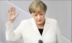  ?? DPA-BILD: KAPPELER ?? Angela Merkel wird im Bundestag vereidigt.